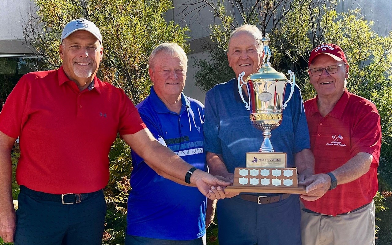 Four golfers holding the trophy, having won the MDCGC 2025