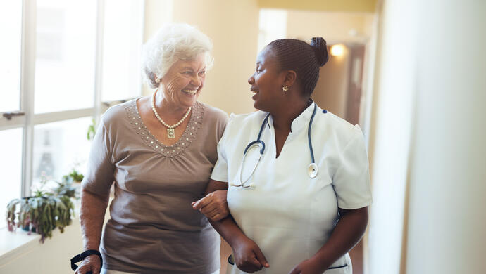 Nurse Assisting Senior Woman
