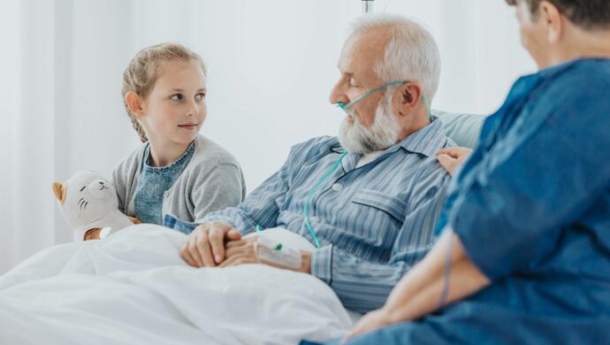 Granddaughter Talking with Grandfather and Nurse