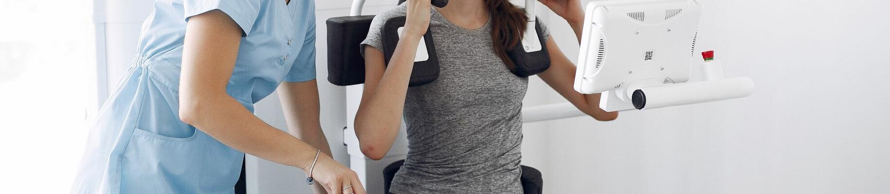 Woman going through Rehabilitation with Nurse after Injury