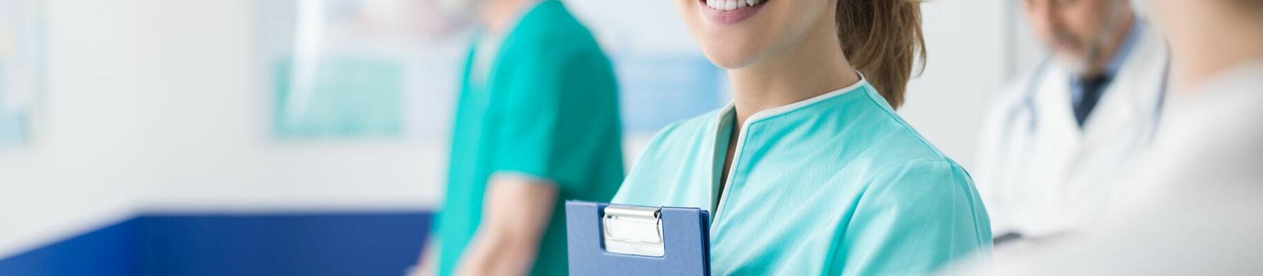 Young Smiling Nurse Working at Hospital