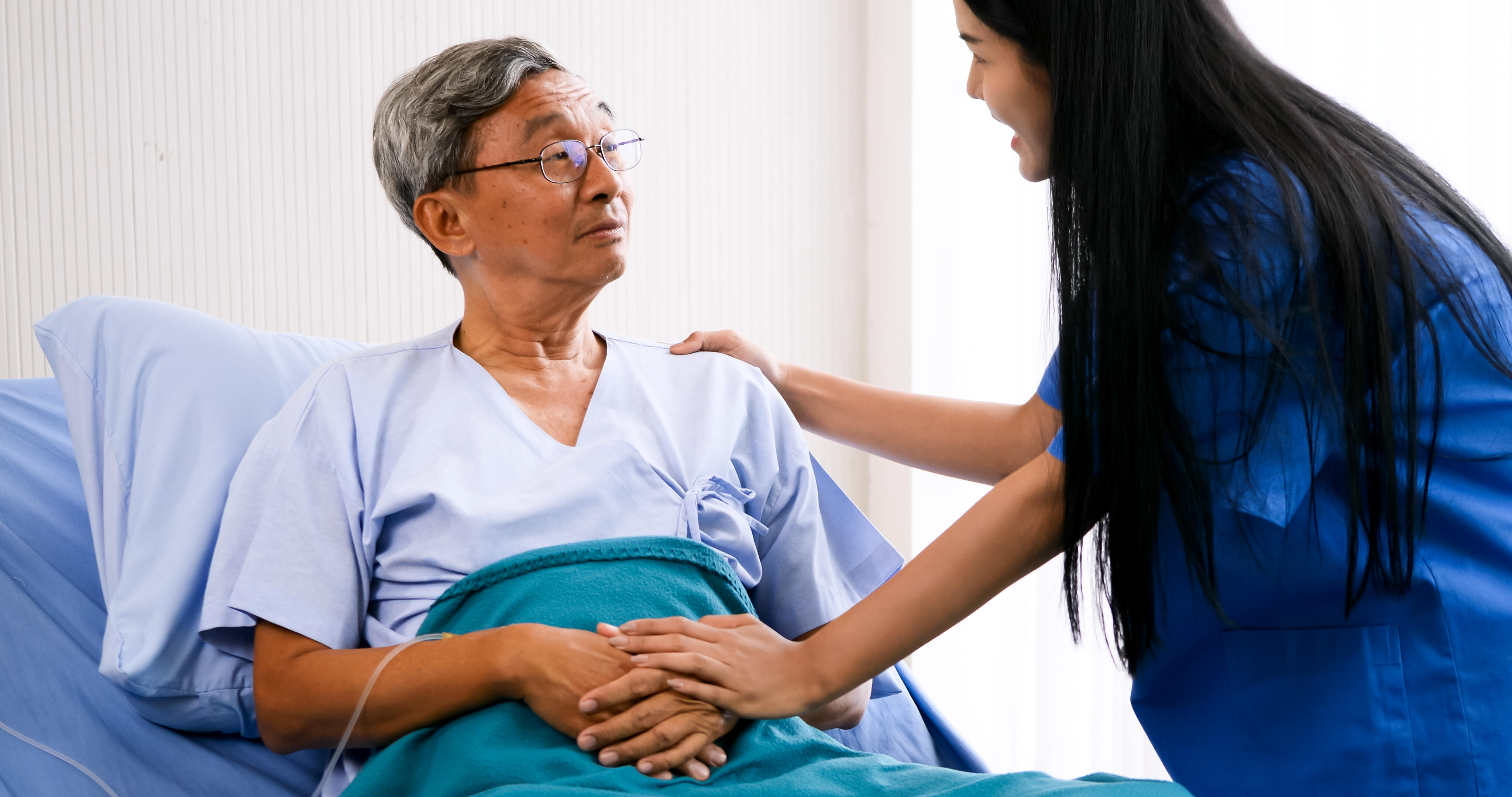 Female medical assistant taking care of adult patient